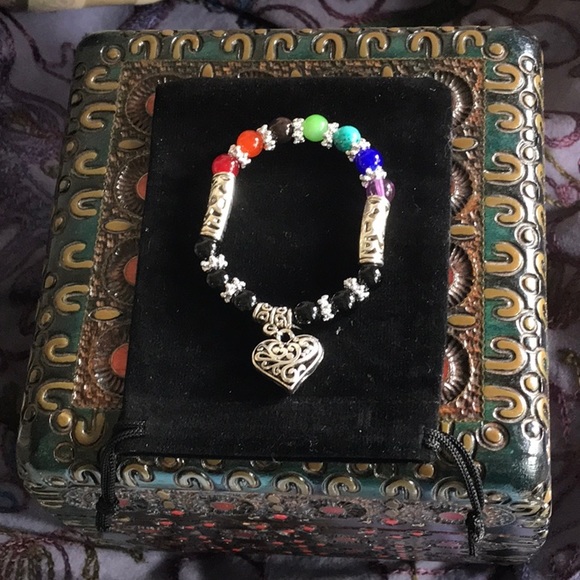 Jewelry - Pretty silver heart bracelet with colorful beads.